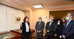 Curator Ivet Tajaryan (L) briefs Matenadaran director Vahan Ter-Ghevondyan (2nd L) and Iranian diplomats on an exhibition of the Qajar-era artworks at the Matenadaran in Yerevan, Armenia. 
