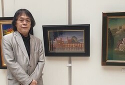 Japanese artist Jun Matsubara poses with his painting “Beautiful Iran” at the Iran-Japan Cultural Exchange Exhibition.
