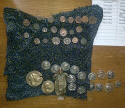 21 historical coins recovered from smuggler