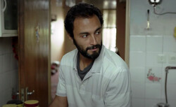 Amir Jadidi acts in a scene from “A Hero”.