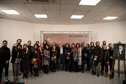 Director Ali Rafiei (C) and “The House of Bernarda Alba” cast members pose with a poster for “Behind the Walls of This House” before the premiere of the documentary at the Iranian Artists Forum in Teh