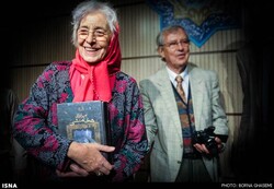 A file photo shows Heidemarie Koch smiling during a ceremony held in Tehran on May 29, 2014, to honor the German Iranologist. Archaeologist Guntram Koch, who is Heidemarie’s husband, is also seen in t