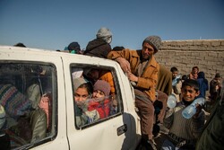 As many of 30 people climb into one truck to drive three hours to the border with Pakistan, with single men in the back and families and children in the front.