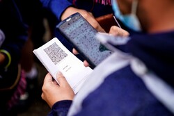 QR codes in paper or digital format are scanned at entries to venues ©Hugo Pfeiffer/Icon Sport/Getty Images