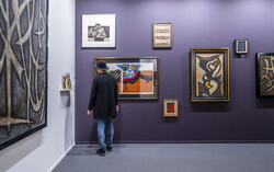 A file photo shows an art lover visiting an exhibition at Art Dubai. 