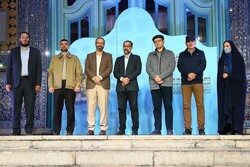 Top experts and writers of the year pose with the organizers after accepting their awards during the Islamic Revolution Art Week at the Art Bureau in Tehran on April 11, 2022.
