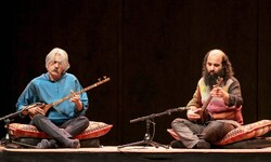 A file photo shows Kamancheh master Kayhan Kalhor and setar virtuoso Kia Tabasian performing. 