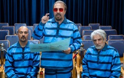 Ahmad Mehrnfar, Reza Attaran and Mehdi Hashemi act in a scene from “Solitary” by Masud Atyabi.