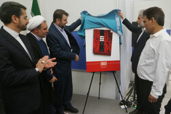 Alhoda director Hojjatoleslam Mohammad Asadi-Movahed (2nd L) and TIBF president Yaser Ahmadvand (2nd R) unveil a poster for the book “Iran-Japan Cinema” at the 33rd Tehran International Book Fair on M