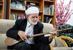 This file photo shows Khorasan maqami music master Osman Mohammad-Parast performing on the dotar. 
