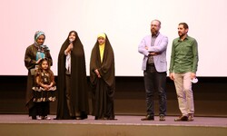 Nuclear scientist Dariush Rezainejad’s widow, Shohreh Pirani (3rd L) talks to the audience during a special screening of “Henas” at Tehran’s Azadi Cineplex on June 10, 2022.