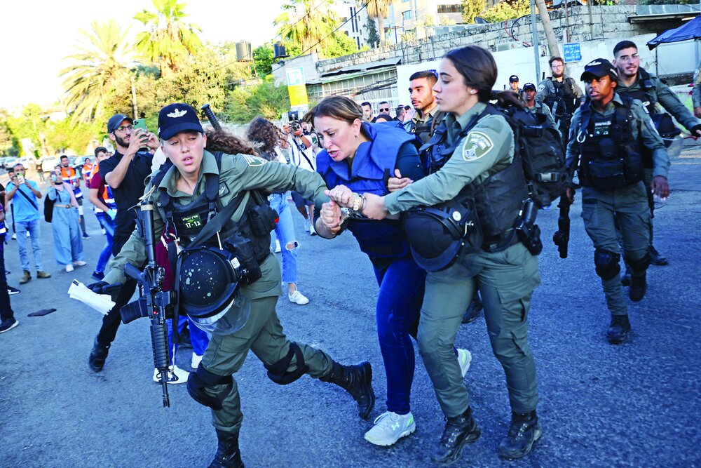 Israelis roughhousing a journalist