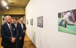 Bosnian Ambassador Samir Veladzic (1st L) and the organizers visit the photo exhibit “White Stones and Broken Hearts” at Tehran’s Niavaran Cultural Center on July 11, 2022. (Tasnim/Vahid Ahmadi)