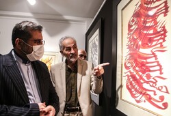 Culture Minister Mohammad-Mehdi Esmaeili (L) visits an exhibition of calligraphic paintings by Jalil Rasuli at the Gooya House of Culture and Art in Tehran on July 12, 2022. (IRNA/Asghar Khamseh)