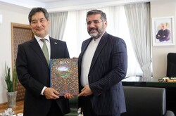 Japanese Ambassador Kazutoshi Aikawa and Minister of Culture and Islamic Guidance Mohammad-Mehdi Esmaeili pose after a meeting in Tehran on July 17, 2022.