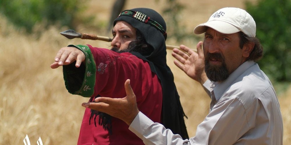 Davud Mirbaqeri (R) directs Farborz Arabnia in a scene from “Mokhtarnameh”.