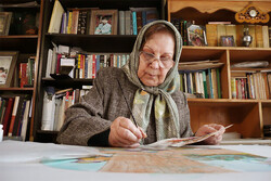 Photo: Master miniaturist Mahin Afshanpur is seen creating a painting in an undated photo.