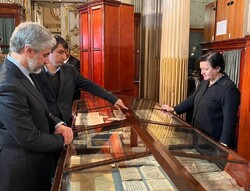 Director of Russia’s Institute of Oriental Manuscripts, Irina Fedorovna Popova (R) accompanies the Iranian Deputy Culture Minister for Cultural Affairs, Yaser Ahmadvand (L), in a visit to the institut