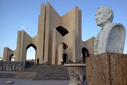 A bust of Persian poet Shahriar is seen in front of Maqbarat ush-Shoara in Tabriz, which houses his tomb and the graves of several other poets.