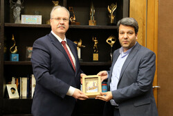 Belarusian Ambassador Dmitry Koltsov and Cinema Organization of Iran director Mohammad Khazaei pose after a meeting in Tehran on October 9, 2022. (COI)