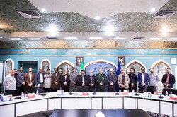 Organizers of the 17th International Resistance Film Festival pose after holding a meeting in Tehran on November 4, 2022 to discuss issues on the event. 
