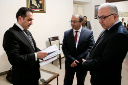 Armenian scholar Vahagn Afyan (L), Ambassador Arsen Avagyan (C) and Armenia’s Deputy Foreign Minister Mnatsakan Safaryan attend a special ceremony at the Embassy of Armenia in Tehran on November 19, 2