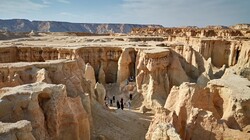 Sightseers tour Stars Valley on Qeshm Island. The spectacular site features a series of majestic gorges and canyons formed over centuries by erosion.