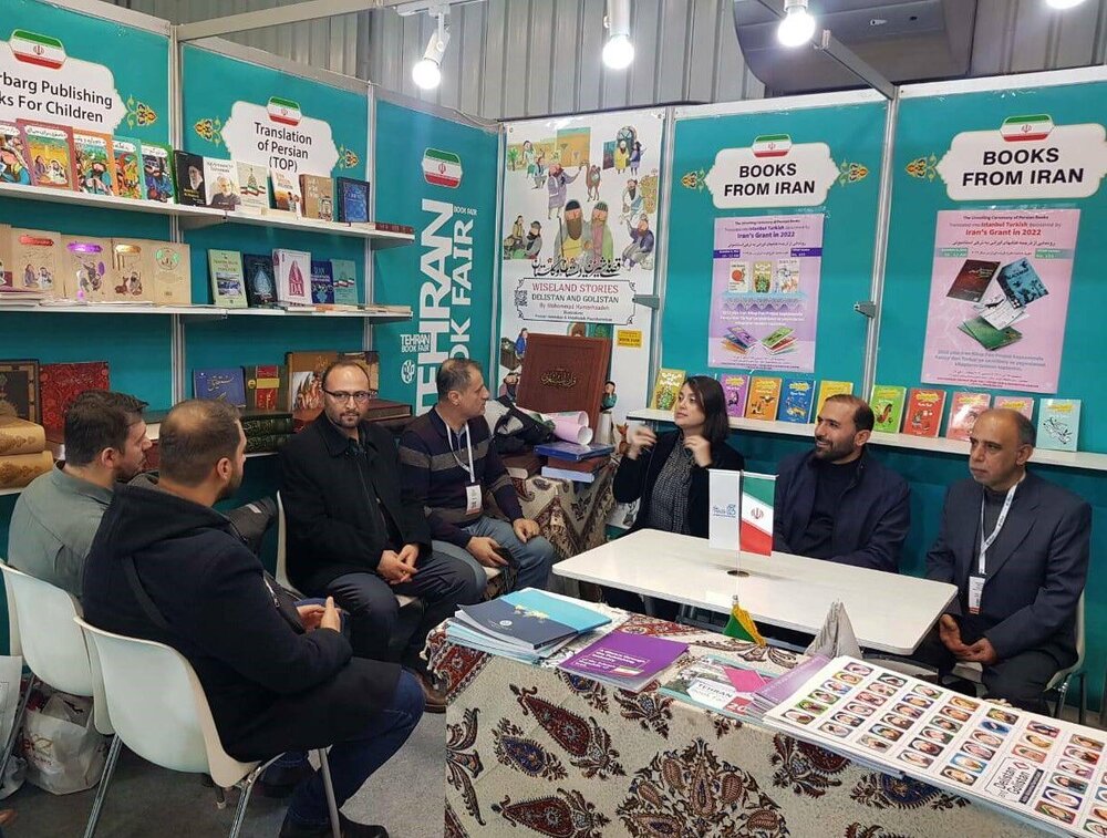Cultural figures attend a meeting in Iran’s pavilion at the 39th International Istanbul Book Fair in Turkey, December 6, 2022, to launch the Turkish editions of several Iranian writers’ books.