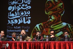 President of the 41st Fajr International Theater Festival, Kurosh Zarei (3rd L) and his colleagues attend a press conference at Rudaki Hall in Tehran on January 17, 2023, to brief the media about the