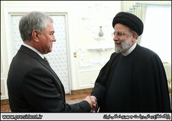 Russian State Duma chairman shakes hand with  Iran's president
