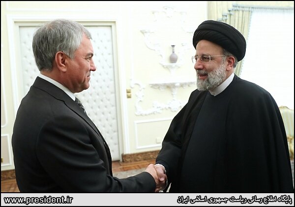 Russian State Duma chairman shakes hand with Iran's president