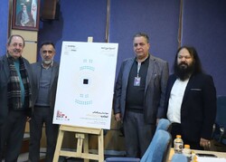 President of the 41st Fajr International Theater Festival, Kurosh Zarei (1st R) and his colleagues pose after unveiling a poster for a conference for a union of the Islamic world theater in Tehran on