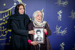 Director Leili Aaj and Sorayya Abdollahi, the leading character of her film “General Sorayya”, attend a photocall for the drama during the 41st Fajr International Film Festival at Tehran’s Mellat Cine