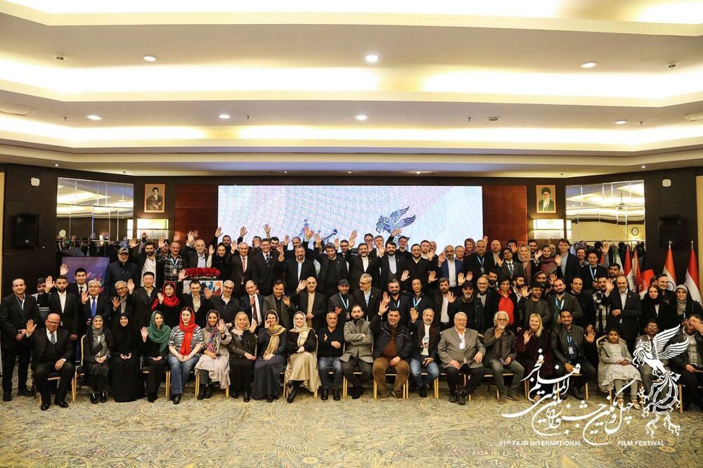 Organizers and foreign guests of the 41st Fajr International Film Festival pose during a banquet at Tehran’s Azadi Hotel on February 9, 2023. (FIFF)