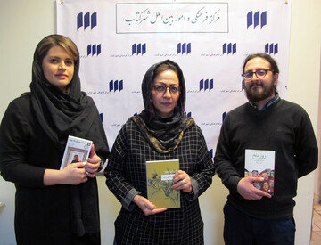 Left to right, the translators Hanieh Pedram, Narges Qandilzadeh and Farid Dabir-Moqaddam hold copies of their works honored by the Abolhassan Najafi Award at the Book City Institute in Tehran on Febr