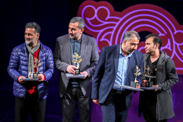 Winners hold their awards during the closing ceremony of the 15th Fajr Festival of Visual Arts at Tehran’s Vahdat Hall on February 24, 2023. (ISNA/Majid Khahi)