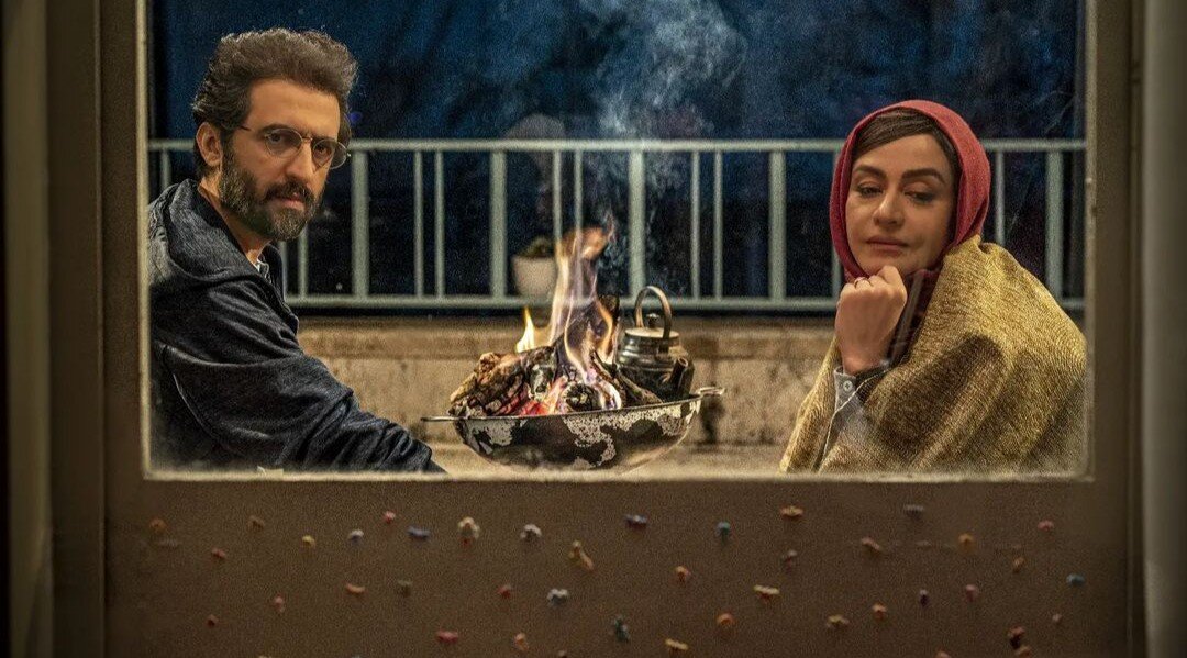 Behruz Shoeibi and Merila Zarei act in a scene from “Henas”.