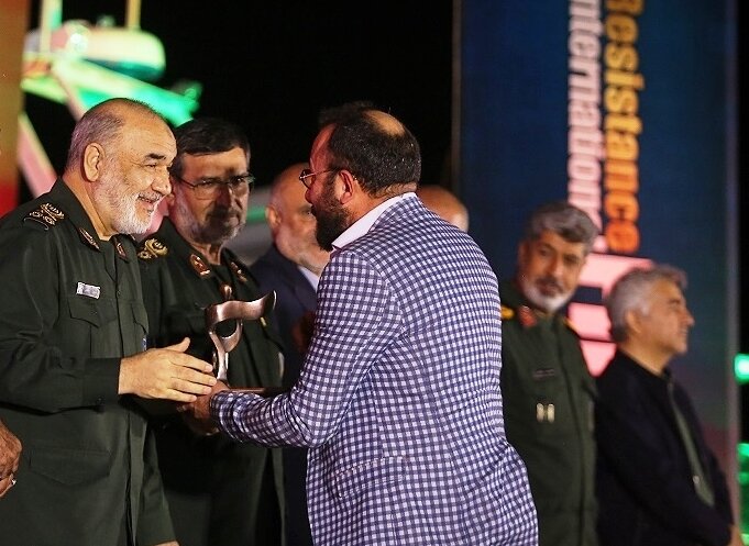 IRGC chief Major General Hossein Salami awards a winner during the closing ceremony of the 17th International Resistance Film Festival on Shahid Abdollah Rudaki warship in Assaluyeh Port on March 8, 2