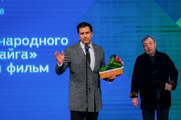 Iranian director by Shahram Ebrahimi speaks after receiving the Golden Taiga for best film for his drama “Parallax” from the jury president Pavel Lungin