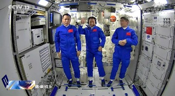 This file photo shows Chinese astronauts Tang Hongbo (L), Nie Haisheng (C) and Liu Boming posing inside the Tianhe core module of China’s space station. (CCTV)