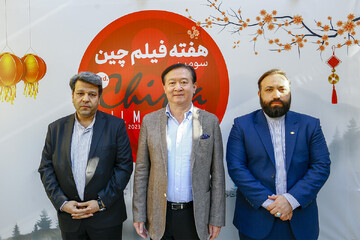 Cinema Organization of Iran director Mohammad Khazaei (L), Chinese Ambassador Chang Hua (C) and FCF director Mehdi Javadi attend the China Film Week at the Farabi Cinema Foundation in Tehran on May 6,