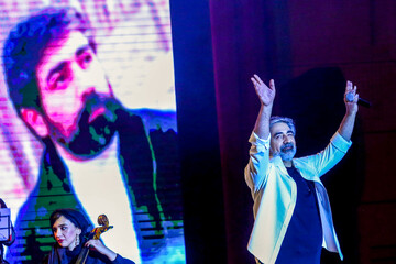 Pop singer Hossein Zaman waves to the audience during a concert at Tehran’s Milad Tower on July 25, 2019. (ISNA/Vahid Hosseini)