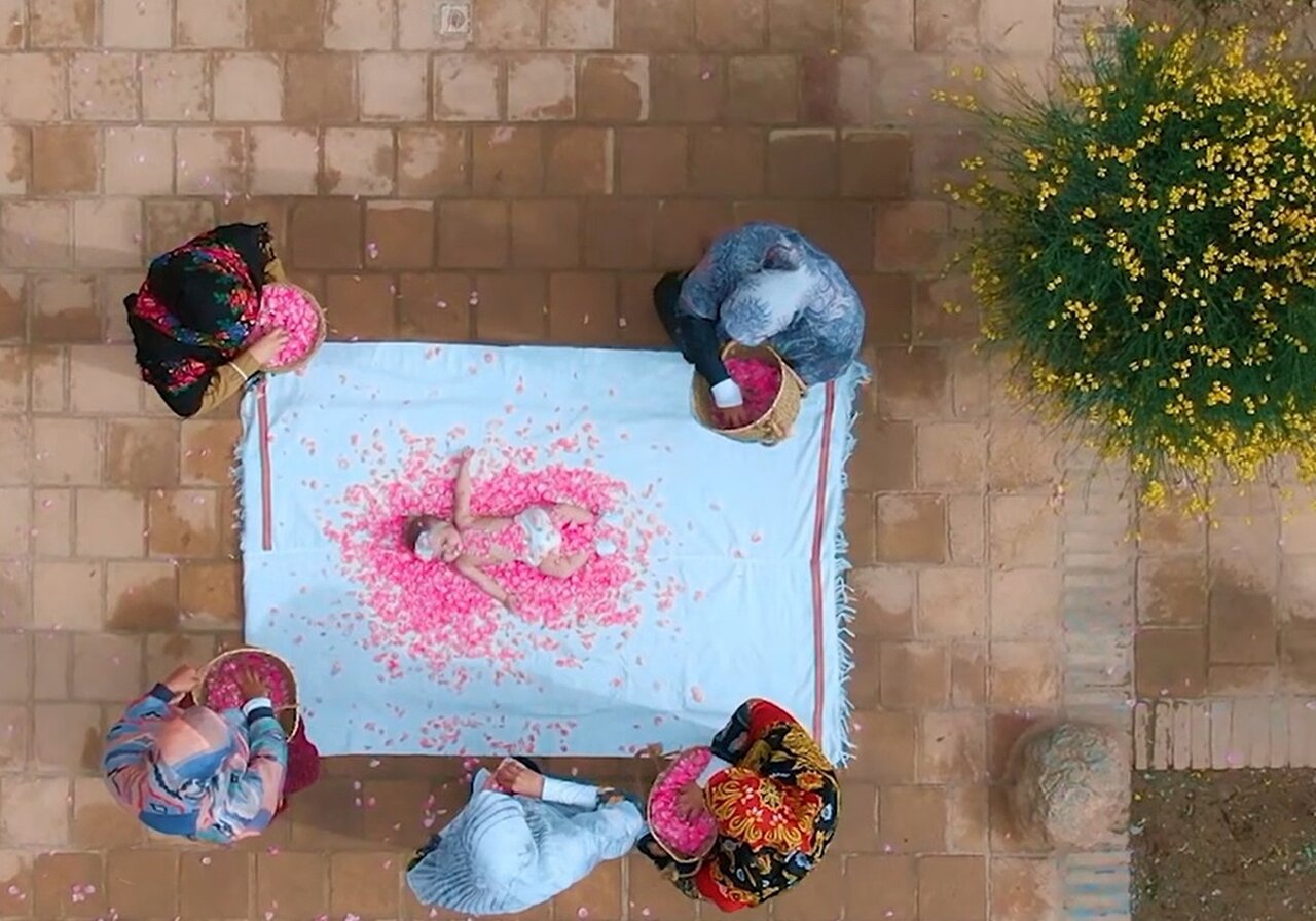 Soothing touch of petals: babies embrace ancient ritual