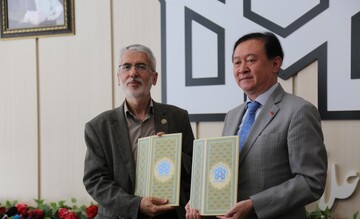 Allameh Tabatabai University Chancellor Abdollah Motamedi and Chinese Ambassador Chang Hua pose after signing a memorandum of understanding in Tehran on May 27, 2023, to establish a library for Chines