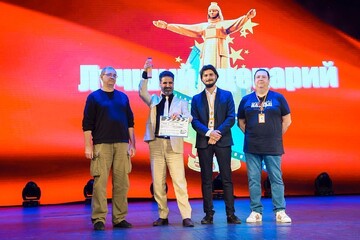 Director and writer Adel Tabrizi (2nd L) holds the award for best screenplay at the closing ceremony of the 16th Cheboksary International Film Festival in Russia on June 1, 2023. Jury members are also