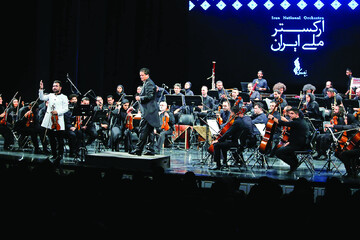 Iran’s National Orchestra under conductor Arash Amini performs in honor of its founder Farhad Fakhreddini at Tehran’s Vahdat Hall on June 22, 2023. (IRNA/Amin Jalali)