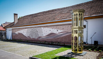 Work of the Iranian painter Ali Rastroo alongside a replica of wind tower monument is seen in Jászberény in honor of the sister city relationship between Iran’s Yazd and the Hungarian city.