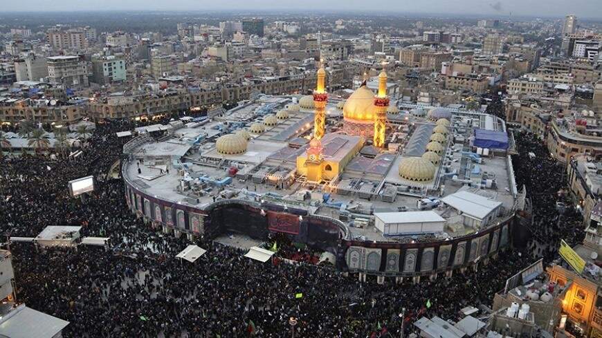 Men distribute fruits to Shiite Muslim pilgrims marching from Baghdad towards the shrine city of Karbala.