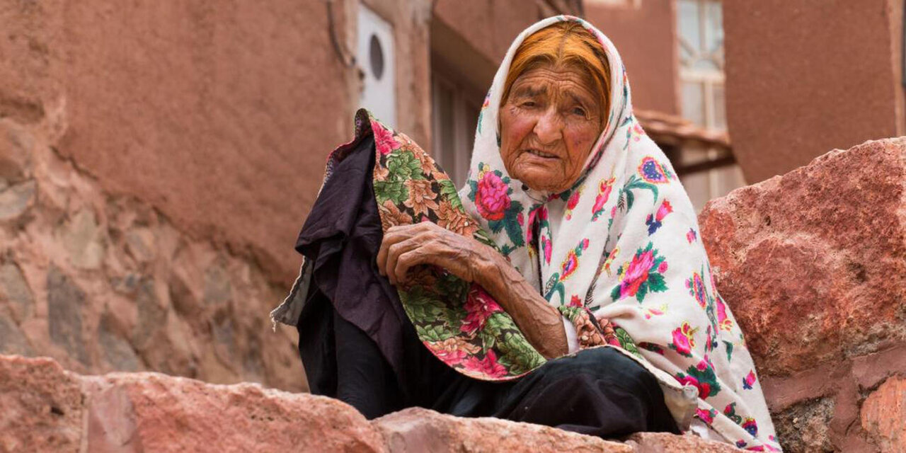 A local woman wearing traditional floral attire is seen in the touristic village of Abyaneh, which is situated in the foothills of Mount Karkas, central Iran.