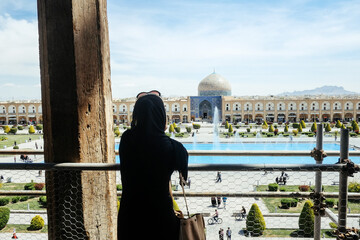 A traveler looks at the UNESCO-designated Imam Square from the centuries-old terrace of Ali Qapu palace of Iran’s Isfahan in an undated file photo.